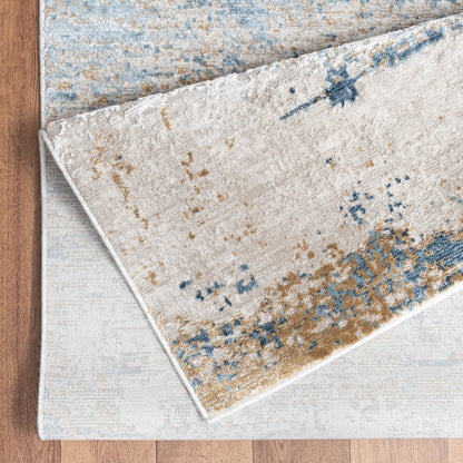 Textured area rug with abstract pattern on a wooden floor
