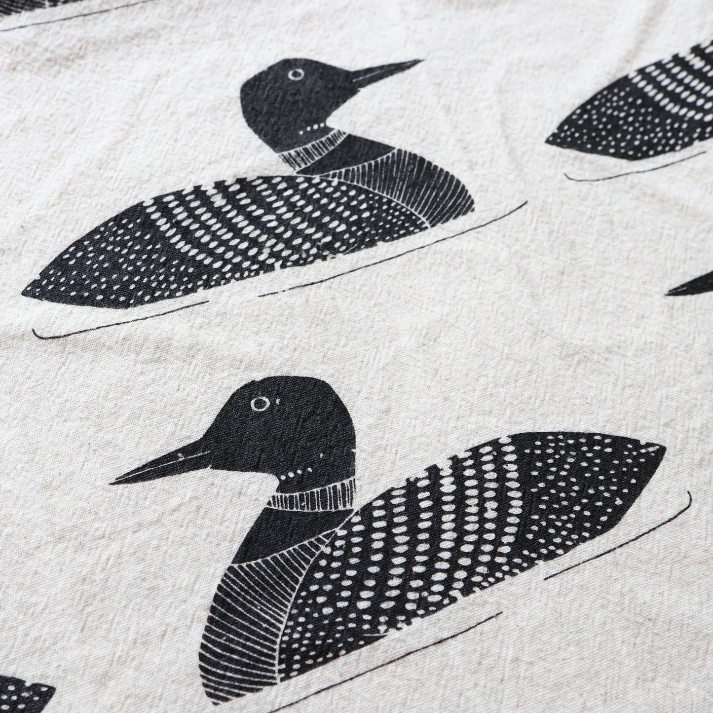 Pattern of black loon birds on a light gray background